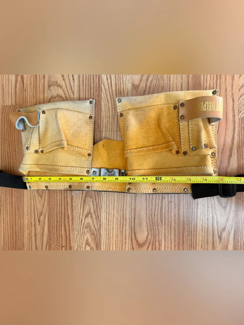 Suede leather Tool-belt that says ”Daddy Helper”n large gold letters in front.